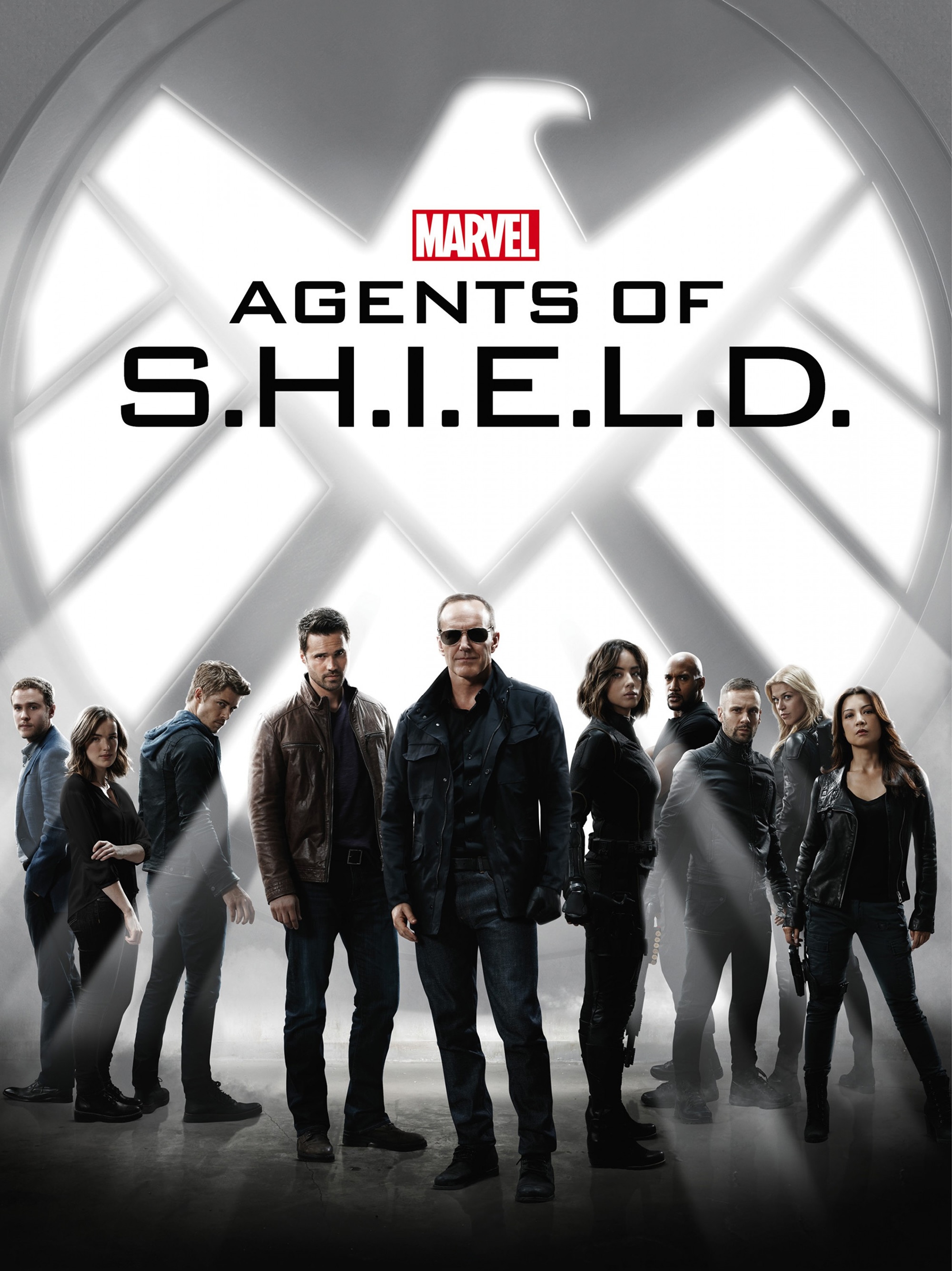 Agents of S.H.I.E.L.D. poster: the team standing under the S.H.I.E.L.D. eagle, Coulson front and center